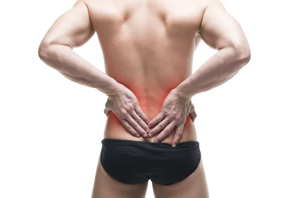 Hombre con dolor de espalda. Cuerpo masculino muscular. Guapo culturista posando en el estudio. Aislado sobre fondo blanco con punto rojo —  Fotos de Stock