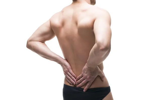 Hombre con dolor de espalda. Dolor en el cuerpo humano. Cuerpo masculino muscular. Aislado sobre fondo blanco —  Fotos de Stock