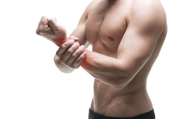 Dolore alla mano. Corpo maschile muscolare. Bellissimo bodybuilder in posa in studio. Isolato su sfondo bianco con puntino rosso — Foto Stock