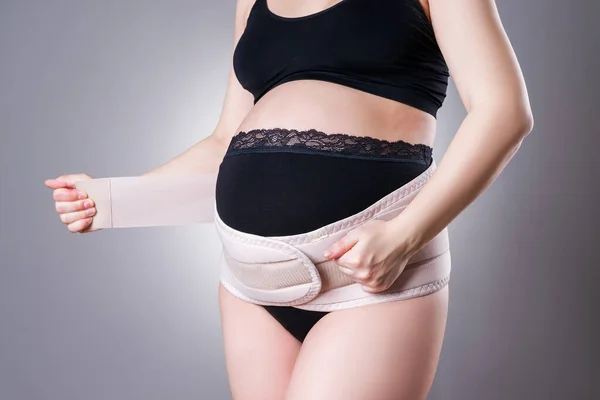 Pregnant Woman Black Underwear Orthopedic Support Belt Pregnancy Bandage Studio — Stock Photo, Image