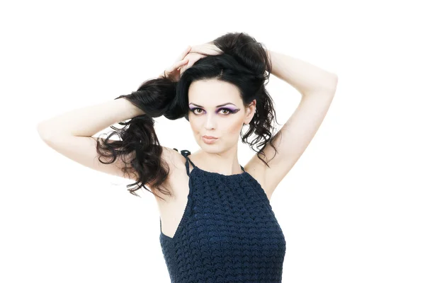 Portrait of a beautiful young woman on a gray background — Stock Photo, Image