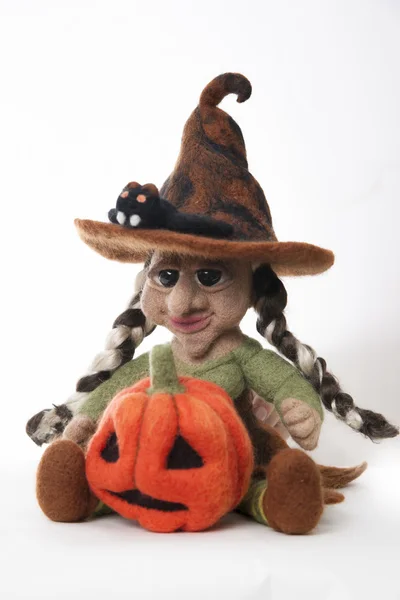 Witch with pumpkin- a toy as a gift for halloween — Stock Photo, Image