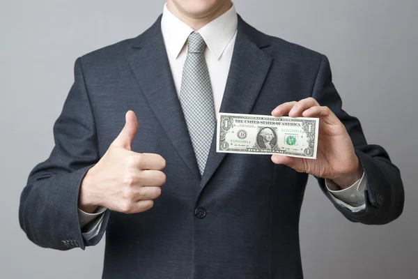 Businessman with money in studio — Stock Photo, Image