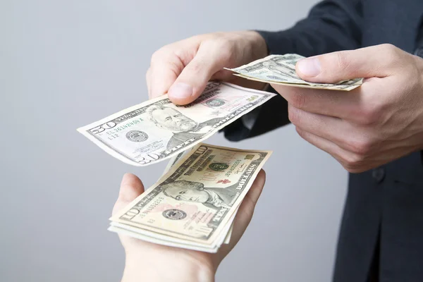 Money in the hands of the people — Stock Photo, Image