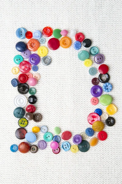 Letter D of the alphabet of buttons of various shapes and colors — Stock Photo, Image