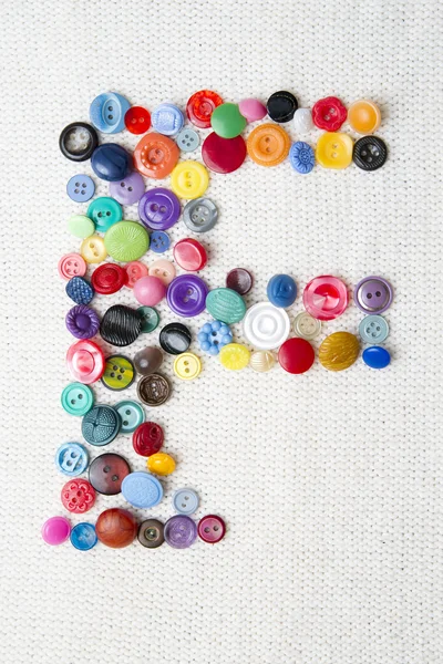 Letra F del alfabeto de botones de varias formas y colores — Foto de Stock
