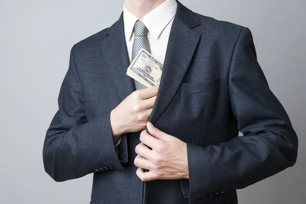 Businessman with money in studio — Stock Photo, Image