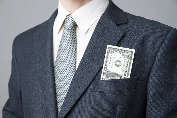 Geschäftsmann mit Geld im Studio — Stockfoto