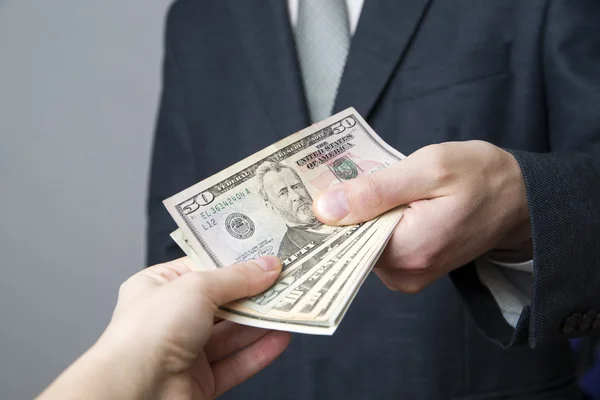 Money in the hands of the people — Stock Photo, Image