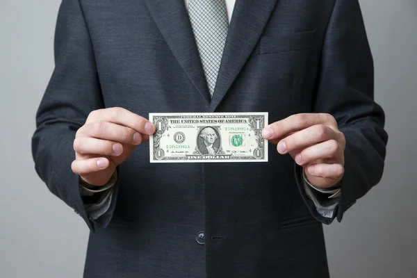 Businessman with money in studio — Stock Photo, Image
