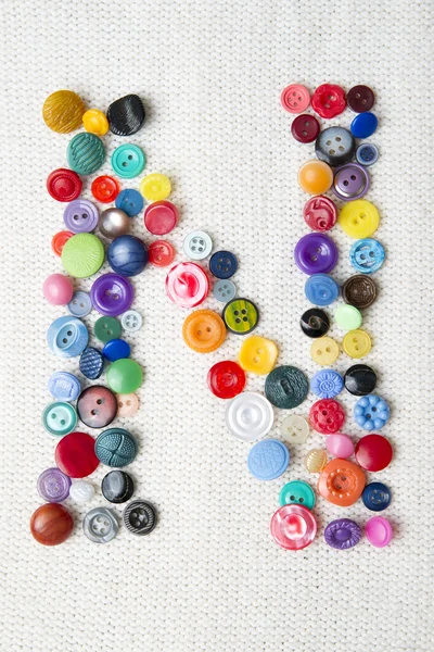 Letter N of the alphabet of buttons of various shapes and colors — Stock Photo, Image