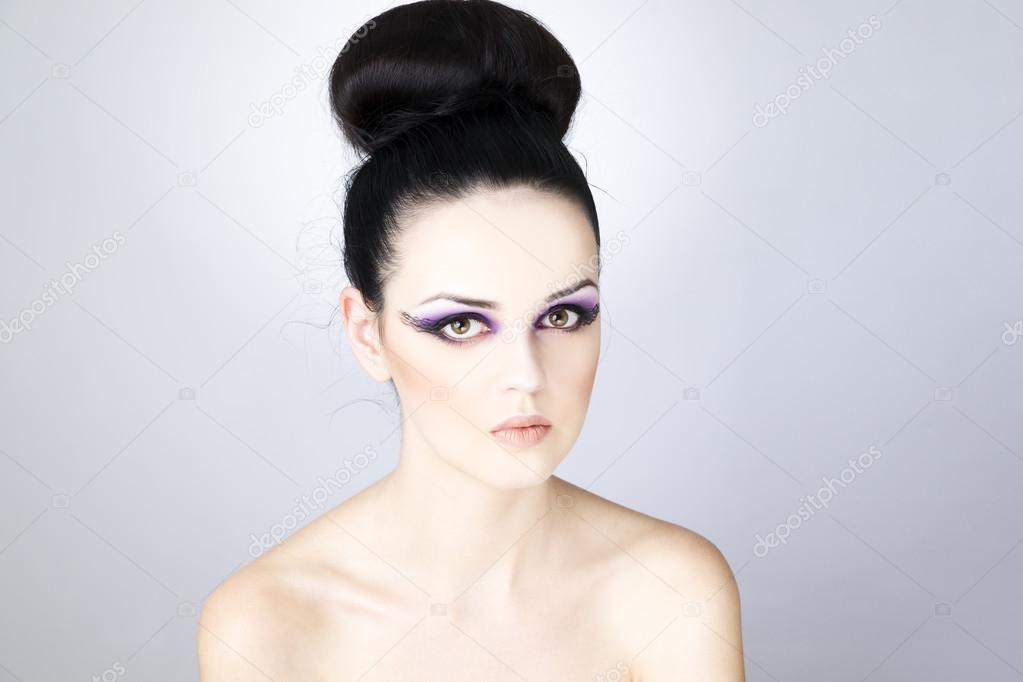 Professional makeup and hairstyle beautiful young woman close up
