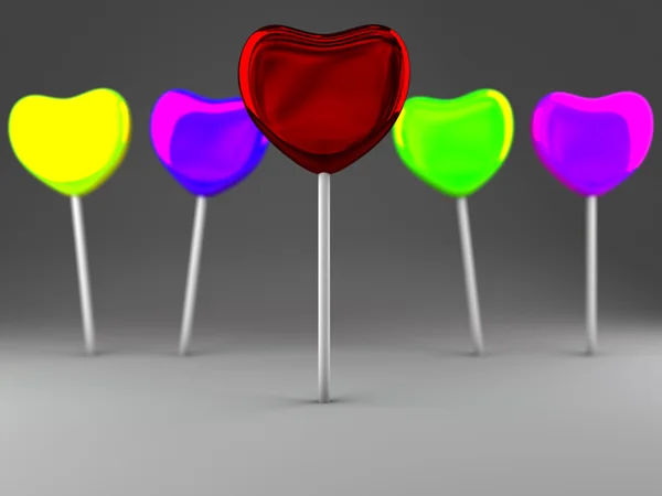Красочные конфеты на палочке на сером фоне — стоковое фото