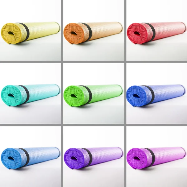 Colored mats for fitness on a white background. — Stock Photo, Image