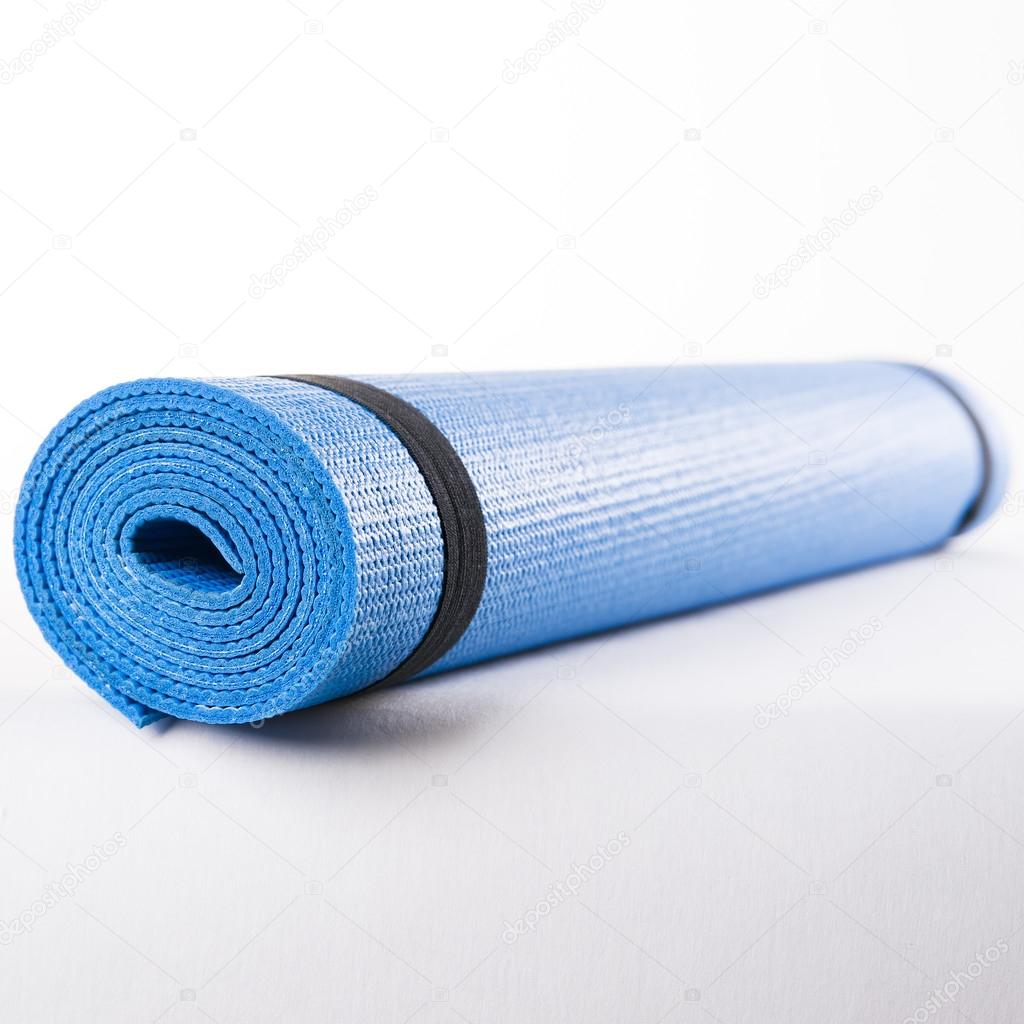 Blue mat for fitness on a white background.