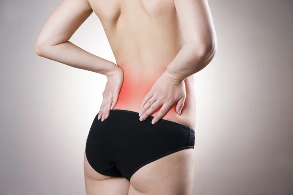 Pain in lower back of women — Stock Photo, Image