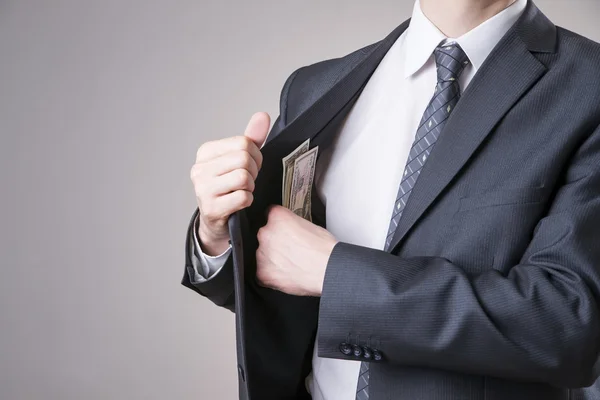 Geschäftsmann mit Geld im Studio — Stockfoto