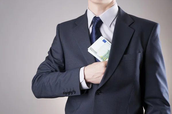 Geschäftsmann mit Geld im Studio — Stockfoto