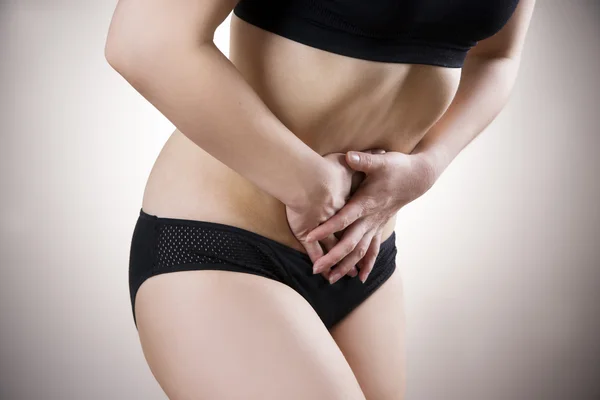 Kobieta z bólem brzucha. Ból w organizmie człowieka — Zdjęcie stockowe