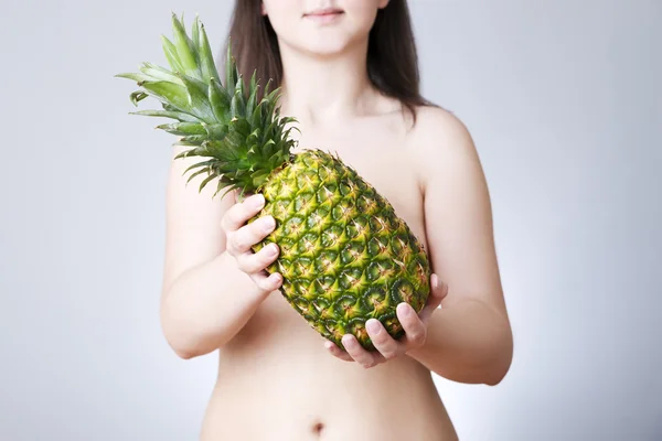 Fat woman with pineapple — Stock Photo, Image