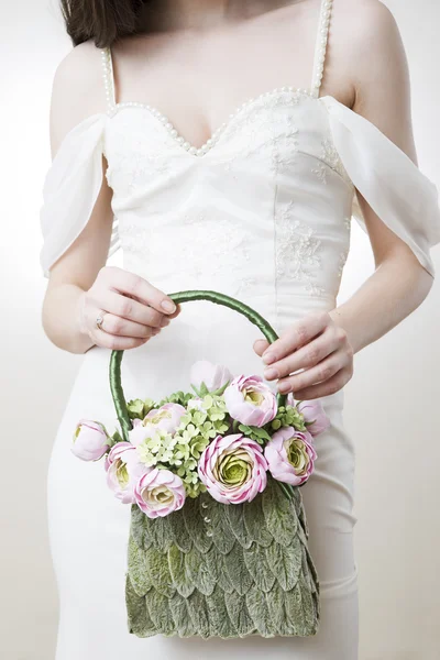 Bride with handbag in her hand — Stock Photo, Image