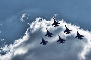 Group su-27 performing aerobatics at an airshow clipart