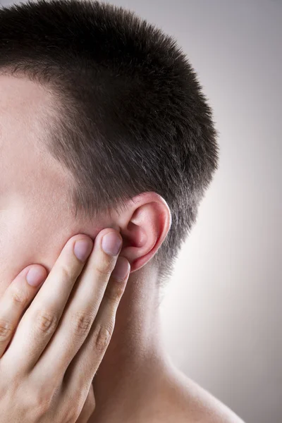 Man met een earache. Pijn in het menselijk lichaam — Stockfoto