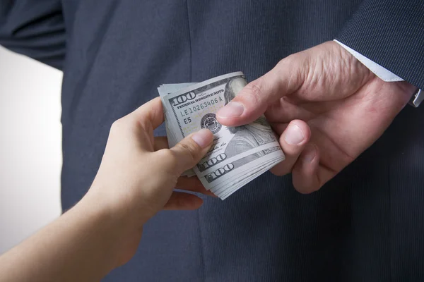 Businessman with money in studio. Corruption concept. Hundred dollar bills — Stock Photo, Image