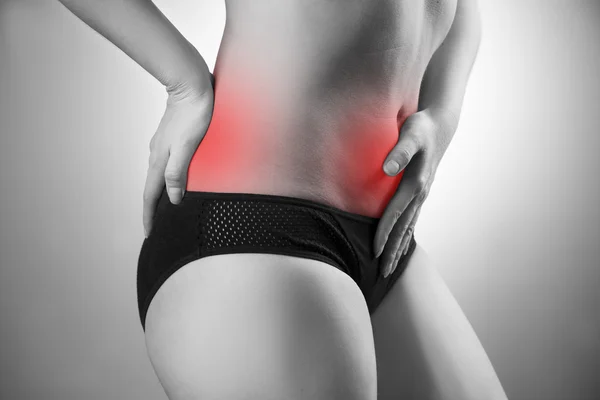 Mulher com dor abdominal e nas costas. Dor no corpo humano — Fotografia de Stock