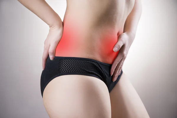 Woman with abdominal and back pain. Pain in the human body — Stock Photo, Image