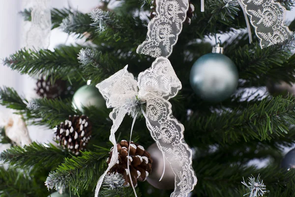 Shiny Christmas balls hanging on pine branches — Stock Photo, Image