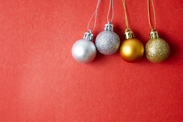 Christmas balls on red background — Stock Photo, Image