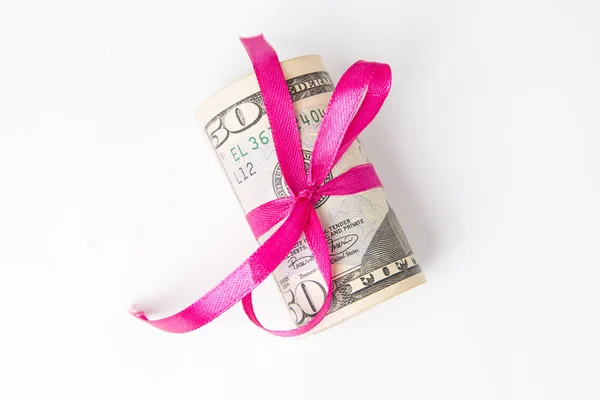 Money with red ribbon on a white background — Stock Photo, Image