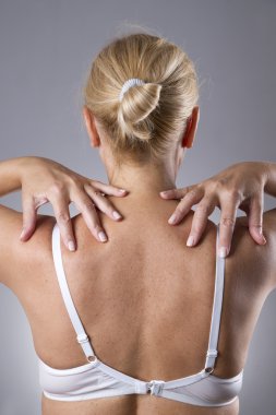 Woman with pain in shoulders. Pain in the human body