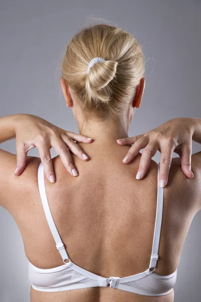 Woman with pain in shoulders. Pain in the human body — Stok fotoğraf