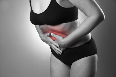 Woman with abdominal pain. Pain in the human body clipart