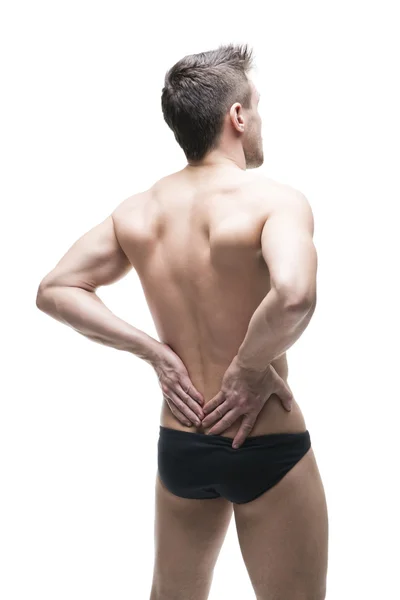 Hombre con dolor de espalda. Dolor en el cuerpo humano. Cuerpo masculino muscular. Aislado sobre fondo blanco —  Fotos de Stock