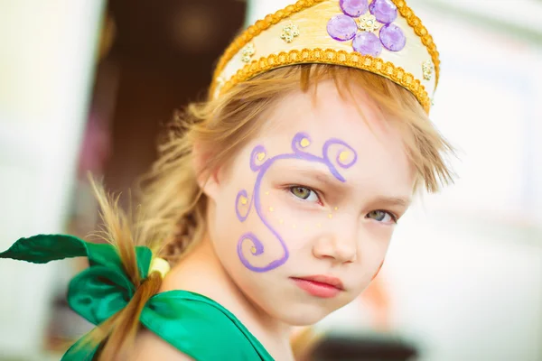 Girl with drawing on her face — Stock Photo, Image
