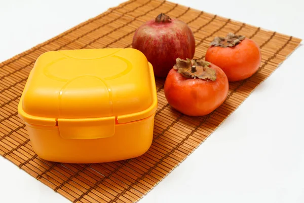 Lunch Box Ripe Pomegranate Persimmon Fruits Bamboo Napkin Organic Fruits — Stock Photo, Image