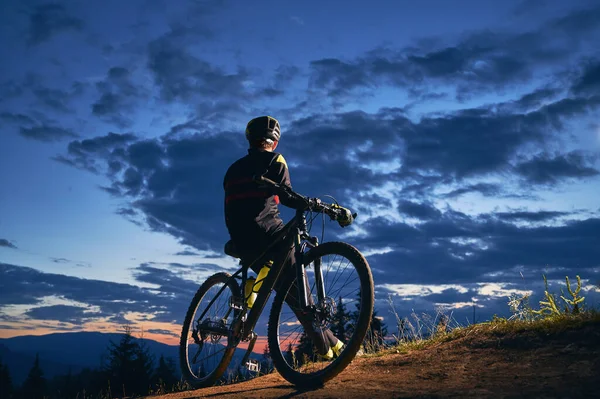 Back View Young Man Cycling Suit Sitting Bicycle Beautiful Night — Stock Photo, Image