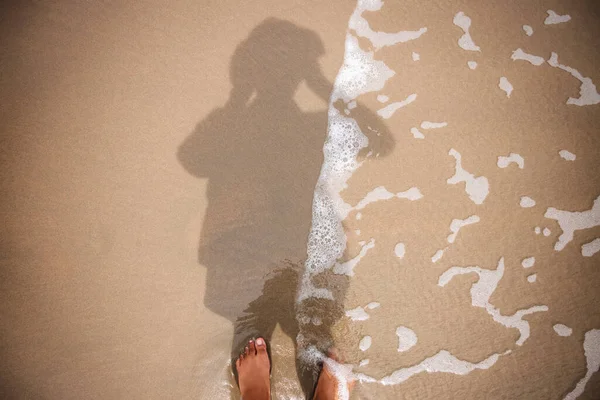 Photographer Taking Self Portrait by Reflection Shadow on Beach Sand. Top View. Summer Vacation. Harmony and Enjoying Life by Close to Nature