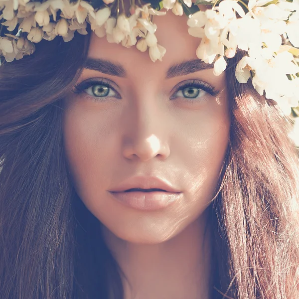 Romantic lady in a wreath of apple trees — Stock Photo, Image