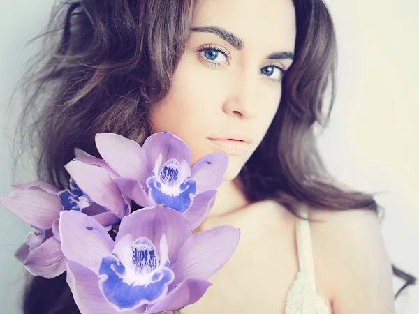 Beautiful lady with orchid — Stock Photo, Image