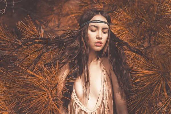 Beautiful lady hippie in fir forest — Stock Photo, Image