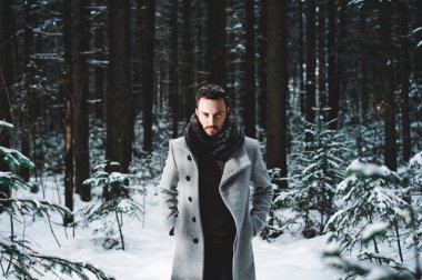 Fashionable handsome man in winter coat clipart