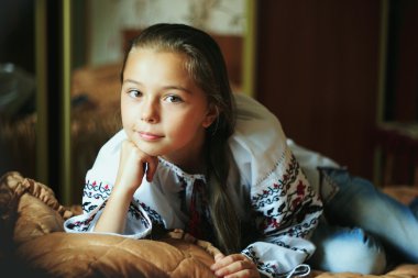 little girl  with traditional Ukrainian shirt clipart