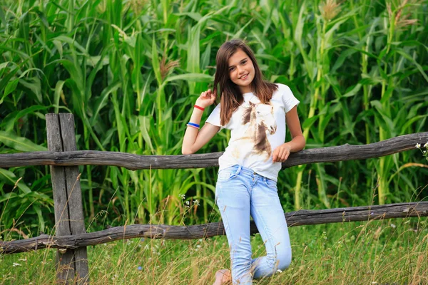 Teenage girl get fun at the farm — Stock Photo, Image