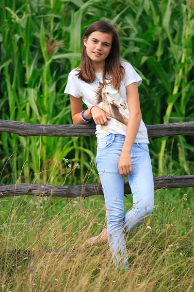 Teenage girl get fun at the farm — Stock Photo, Image