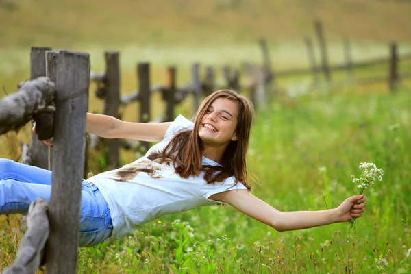 Teenage girl get fun at the farm — Stock Photo, Image