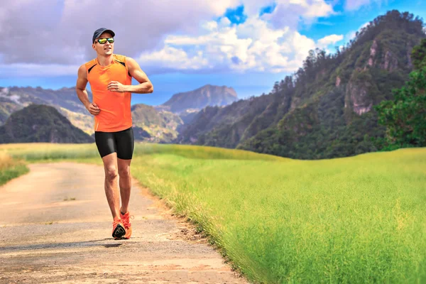 Jogging through the fields — Stock Photo, Image